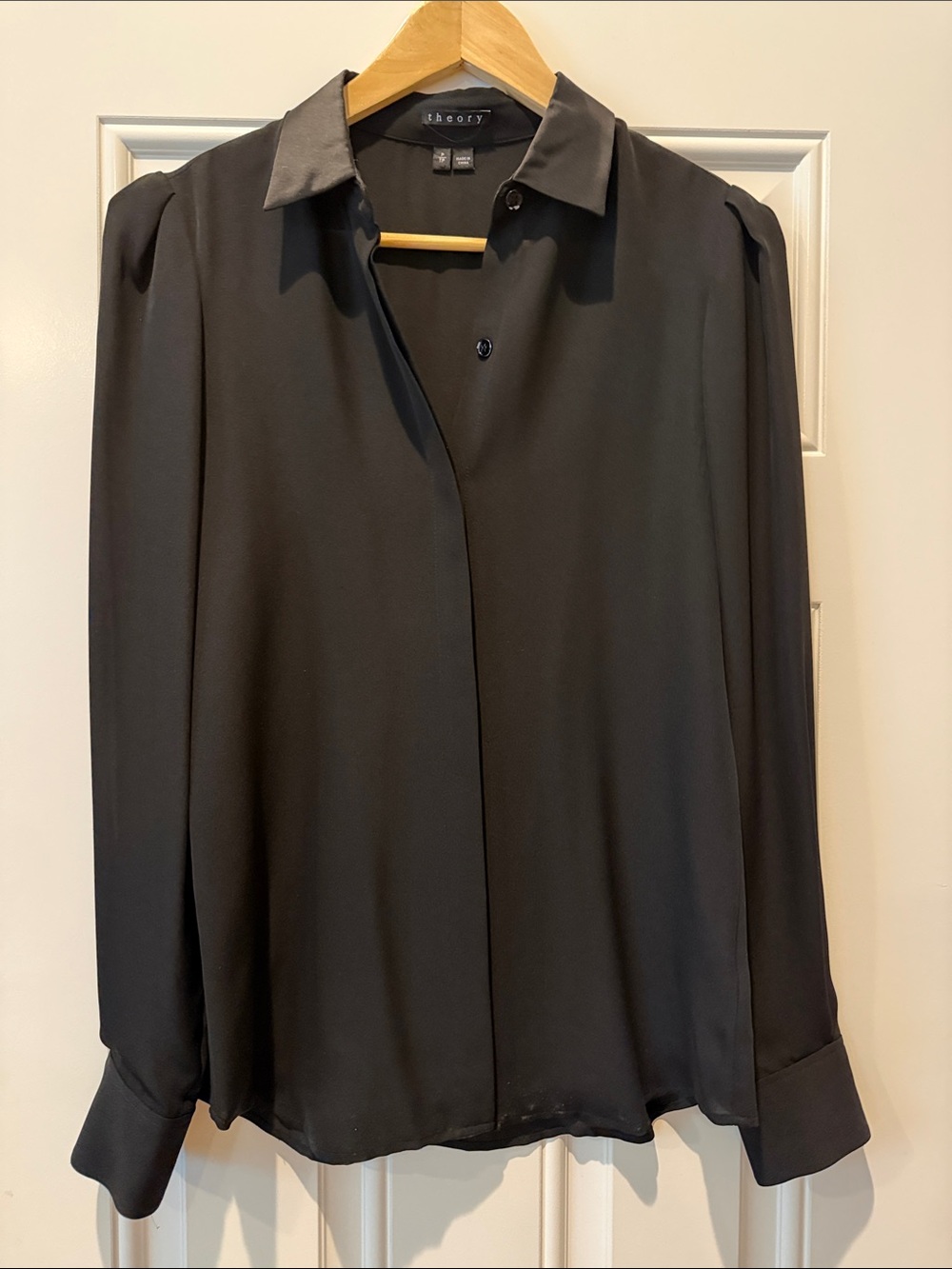 Freshly dry cleaned Theory size p black button up silk blouse